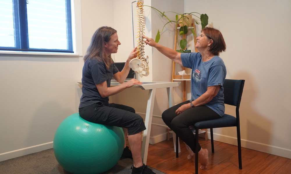 Jane speaking with a client at Hands On Osteo in Tauranga